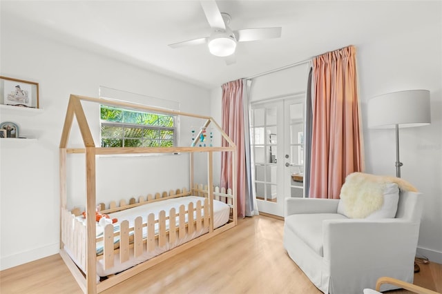 bedroom with hardwood / wood-style floors and ceiling fan