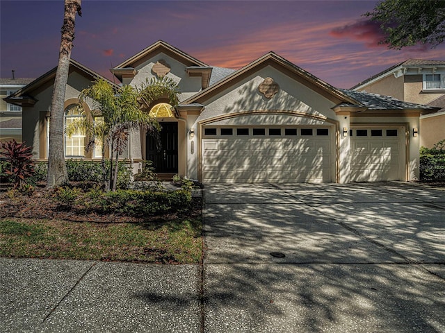 view of front of home with a garage