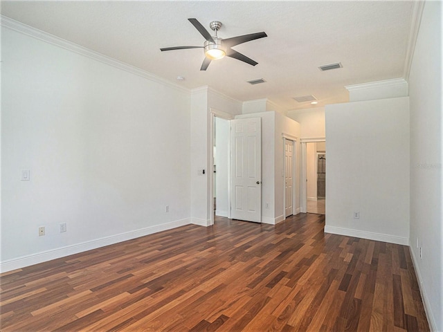 empty room with dark hardwood / wood-style floors, ceiling fan, and crown molding