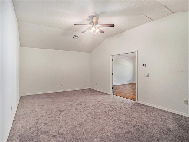 additional living space with carpet flooring, ceiling fan, and vaulted ceiling