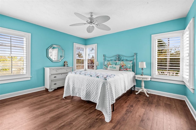 bedroom featuring ceiling fan and dark hardwood / wood-style floors