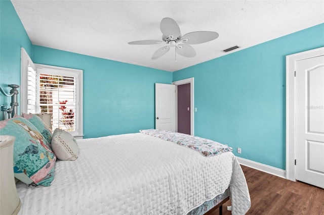 bedroom with hardwood / wood-style flooring and ceiling fan