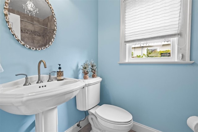 bathroom featuring toilet and sink