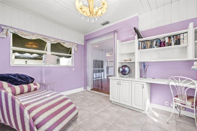 living area with light tile patterned floors and a notable chandelier