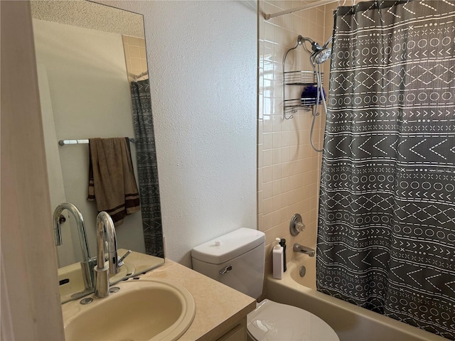 full bathroom with vanity, shower / bath combination with curtain, and toilet