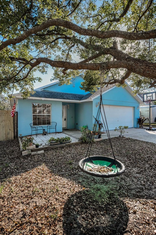 single story home featuring a garage