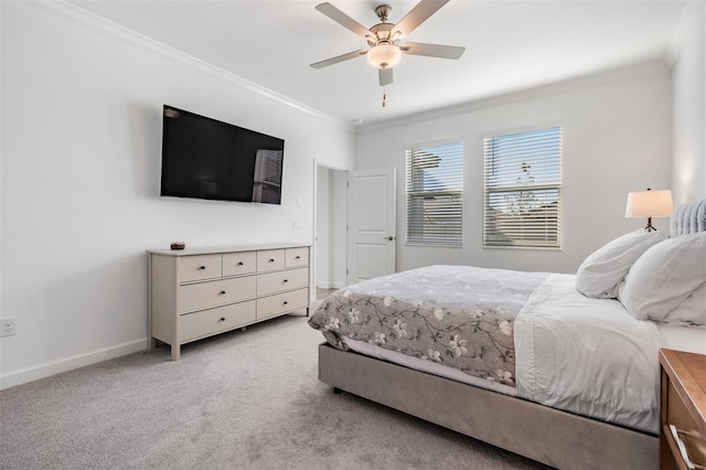 bedroom featuring ceiling fan, crown molding, and light carpet