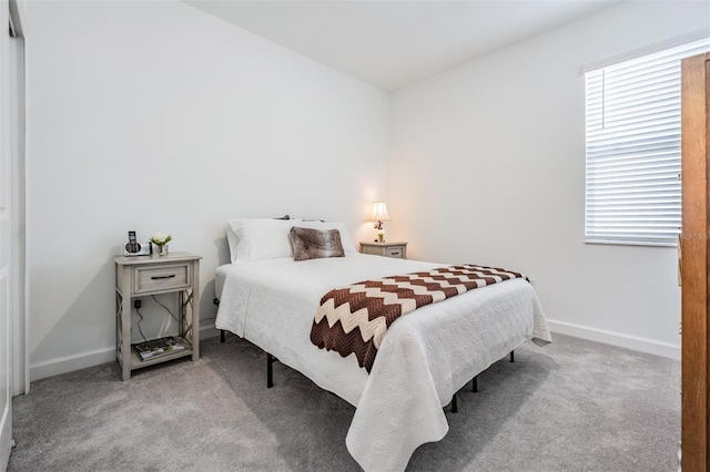 bedroom featuring light colored carpet