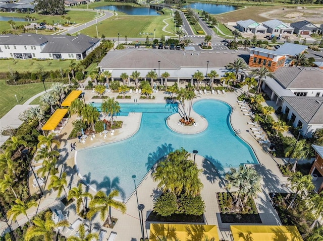 birds eye view of property with a water view