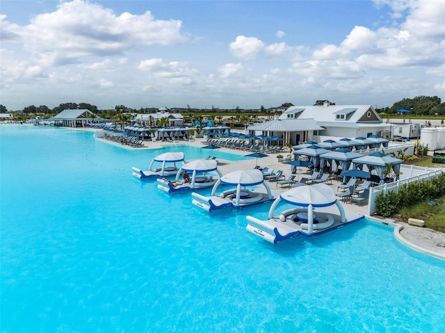 view of pool with a water view