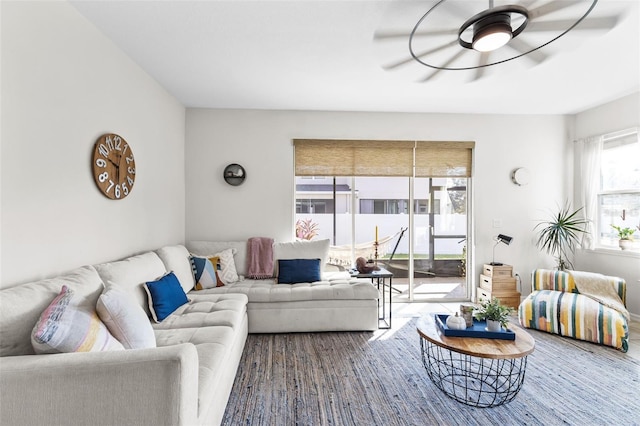 living room with hardwood / wood-style flooring and ceiling fan