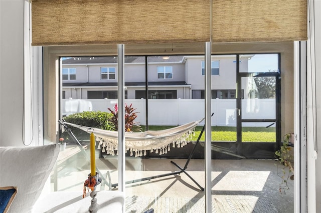 sunroom / solarium featuring a healthy amount of sunlight