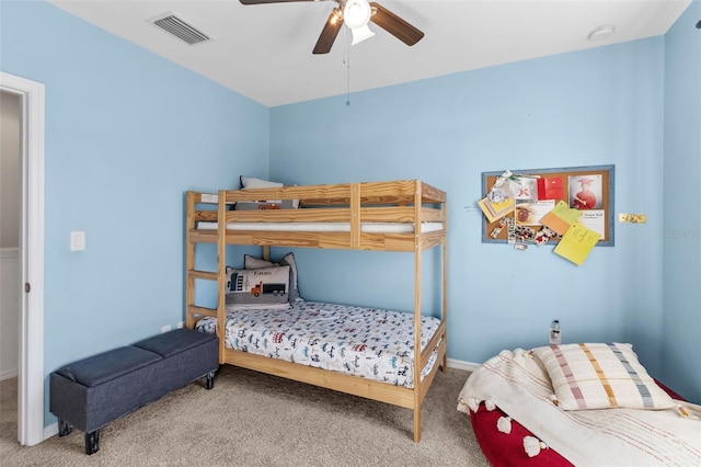 bedroom featuring ceiling fan and carpet