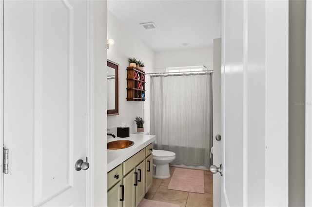 full bathroom with tile patterned flooring, vanity, toilet, and shower / tub combo with curtain