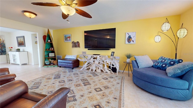 living room featuring tile patterned floors and ceiling fan