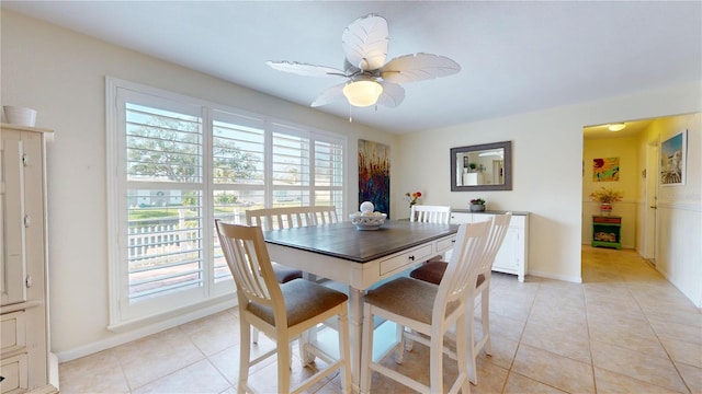 dining space with plenty of natural light, ceiling fan, and light tile patterned floors