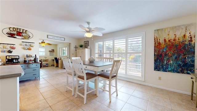 dining room featuring light tile patterned floors and ceiling fan