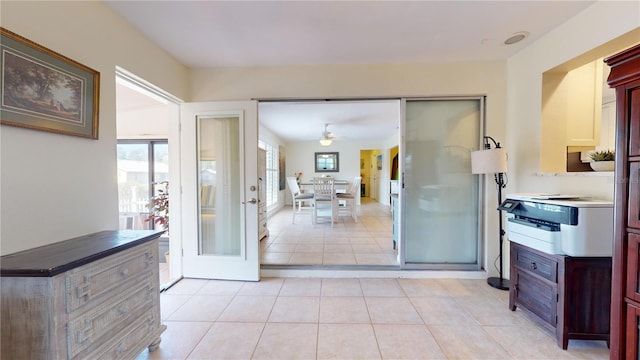 kitchen featuring french doors, ceiling fan, and light tile patterned flooring