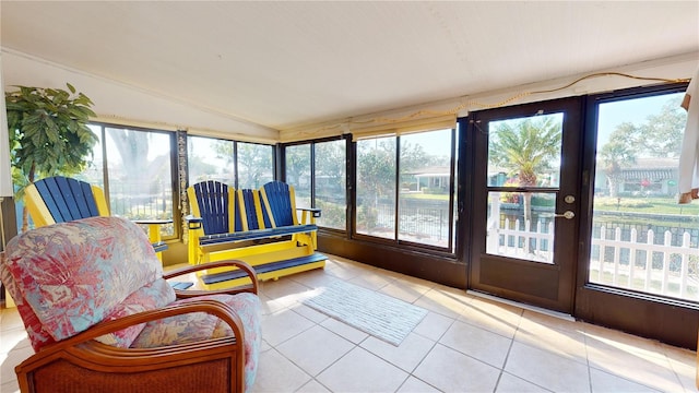 sunroom featuring lofted ceiling