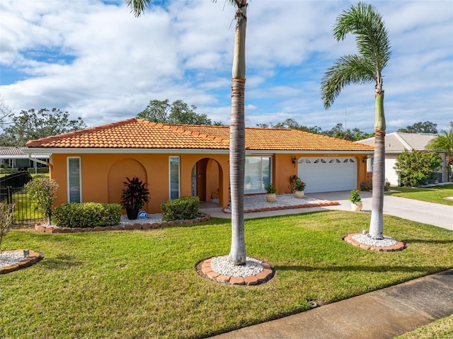 view of front of property with a garage and a front lawn