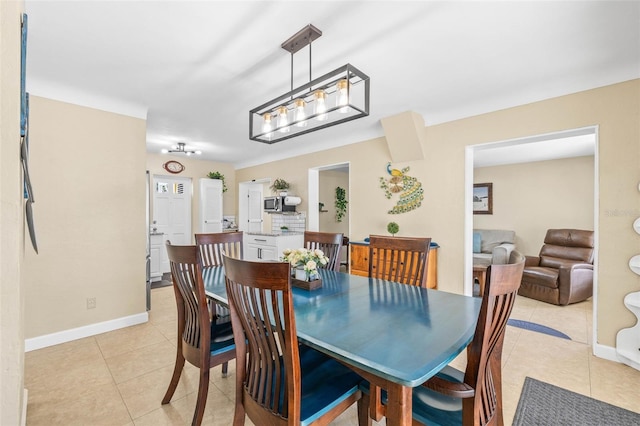 dining area featuring light tile patterned flooring