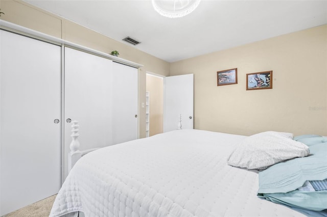 carpeted bedroom with a closet