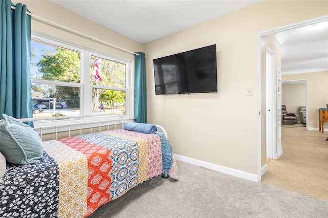 bedroom with light tile patterned floors