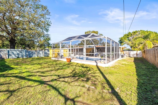 view of yard with a lanai and a patio