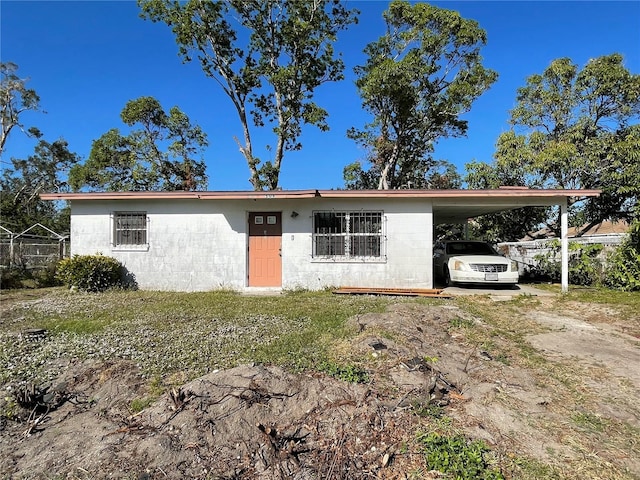 ranch-style house with a carport