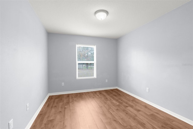 unfurnished room with light hardwood / wood-style flooring