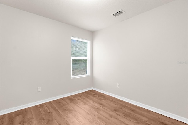 spare room featuring light hardwood / wood-style floors