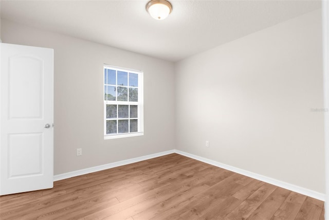 empty room featuring wood-type flooring