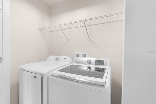 laundry room with independent washer and dryer