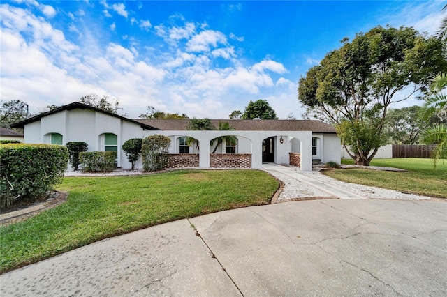 ranch-style house with a front yard