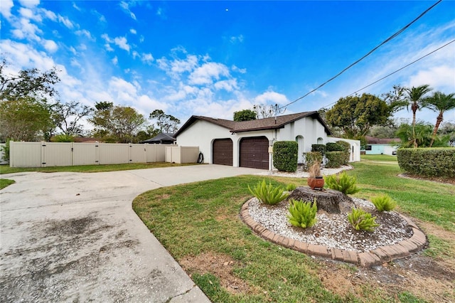 view of property exterior with a lawn and a garage