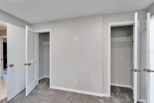 unfurnished bedroom with light colored carpet