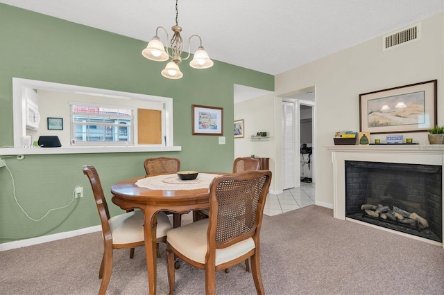 dining space featuring light carpet