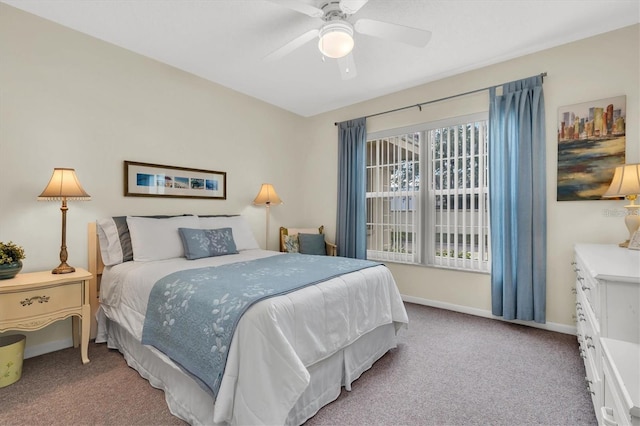 bedroom with light carpet and ceiling fan