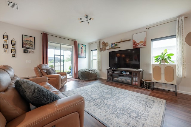 living room with dark hardwood / wood-style floors