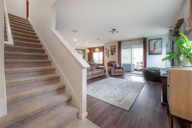 living room featuring dark wood-type flooring