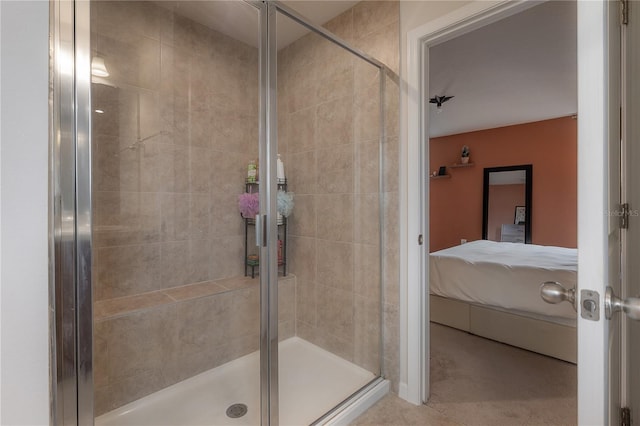 bathroom featuring a shower with shower door