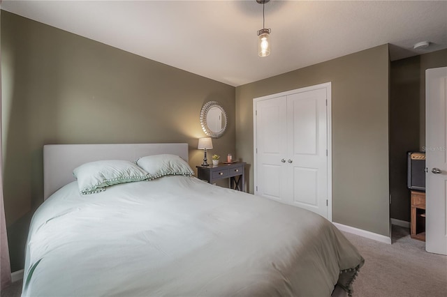 carpeted bedroom featuring a closet