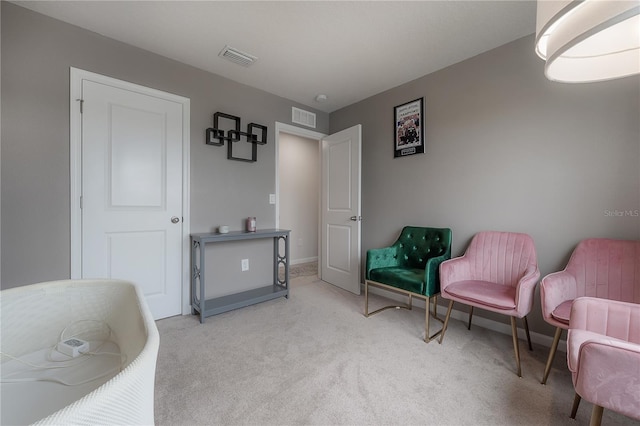 living area with light colored carpet