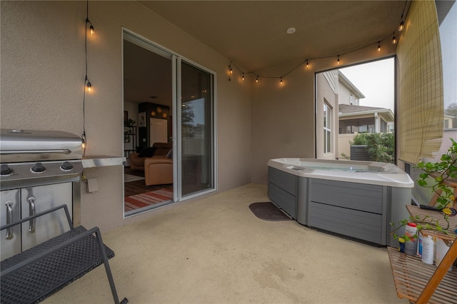 view of patio featuring a grill and a hot tub