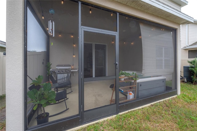 doorway to property featuring cooling unit