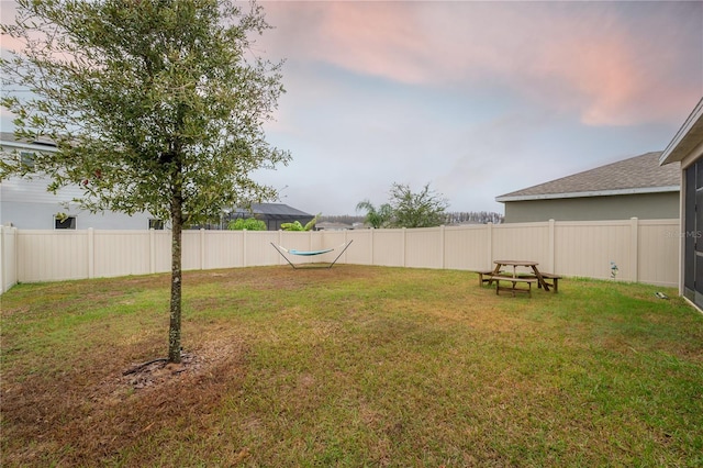 view of yard at dusk