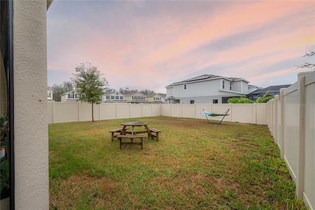 view of yard at dusk