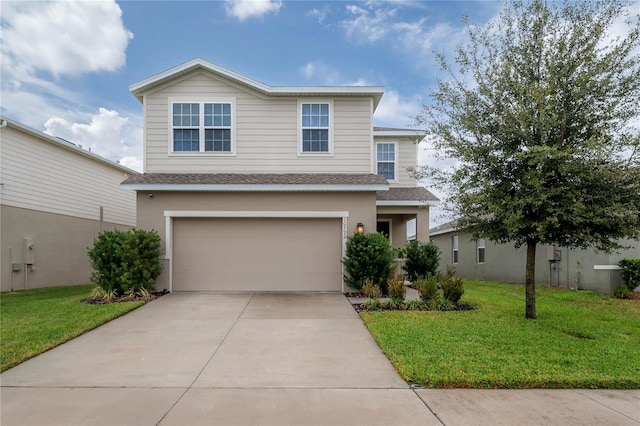 view of front of house featuring a front lawn and a garage