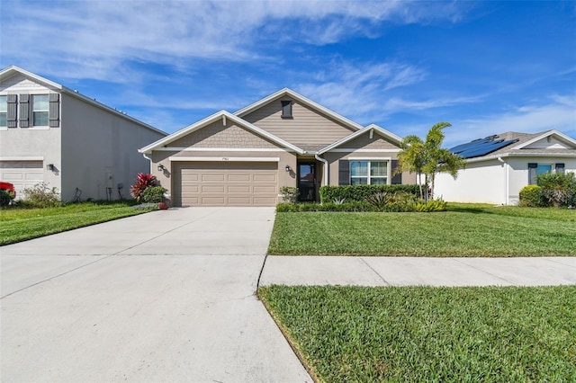 view of front of property featuring a garage and a front lawn