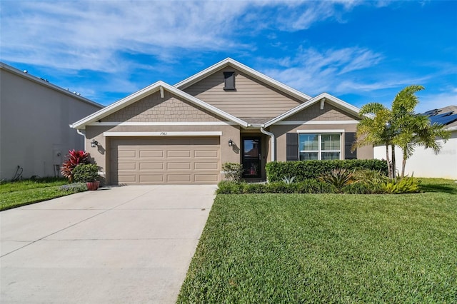 view of front of property featuring a garage and a front yard